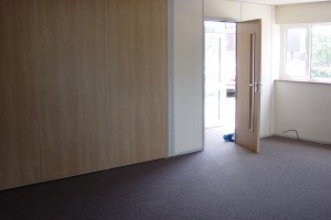 Wood_Effect_Sound_Rated_Sliding_Wall_closed_personel_door_beside